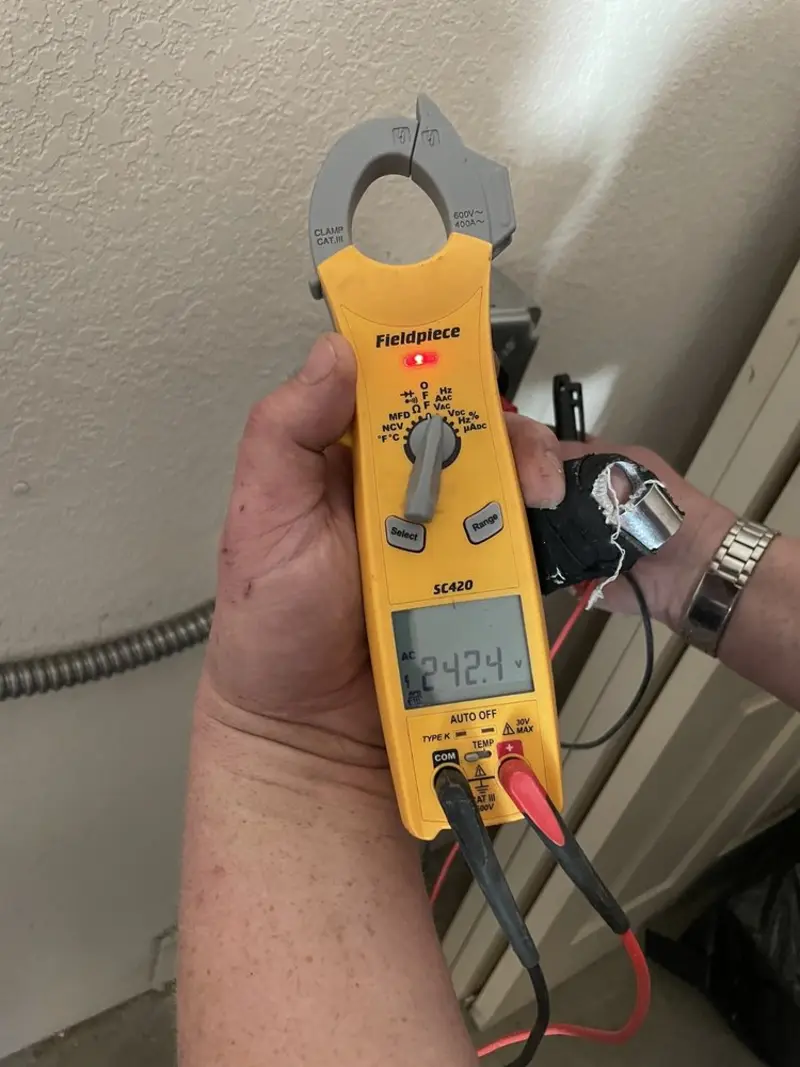 Voltage testing with clamp meter during Electrical Installation Services in Horizon West